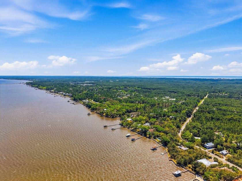 This beautiful waterfront homesite is tucked away in the - photo 8