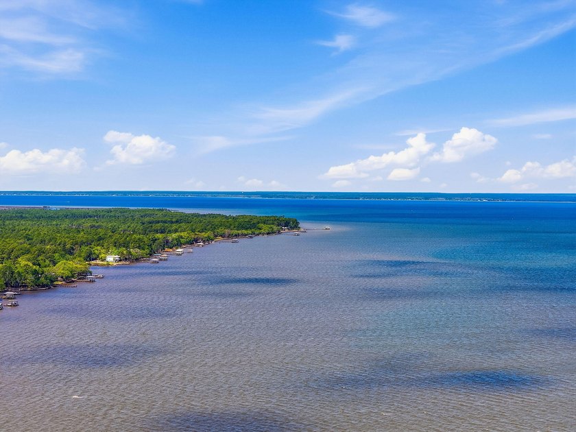 This beautiful waterfront homesite is tucked away in the - photo 9