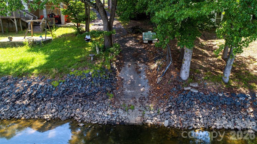 Welcome to this 4-bedroom, 3-bathroom waterfront retreat on the - photo 30