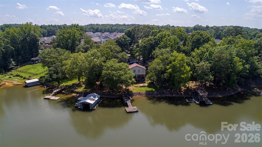Welcome to this 4-bedroom, 3-bathroom waterfront retreat on the - photo 37