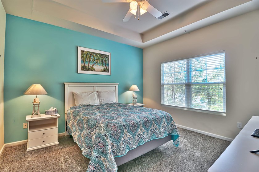TRANSFERABLE GOLF MEMBERSHIP!! The unit is a 3-bedroom, 2 bath - photo 14