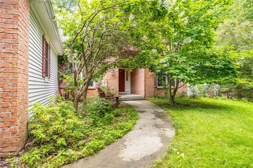 Welcome to this sprawling 2005-built ranch, privately nestled on - photo 2
