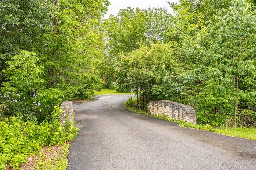Welcome to this sprawling 2005-built ranch, privately nestled on - photo 3