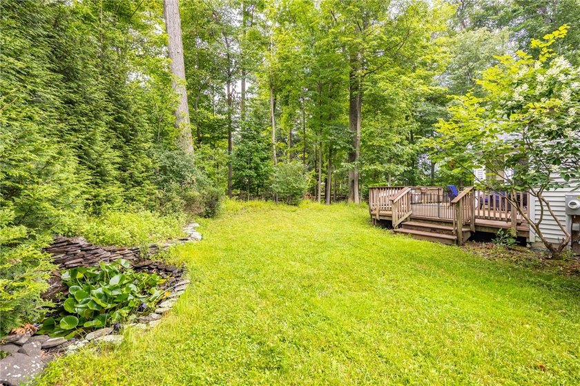 Welcome to this sprawling 2005-built ranch, privately nestled on - photo 4