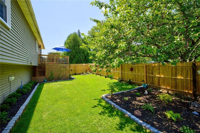 Welcome to this beautifully maintained raised ranch nestled on - photo 12