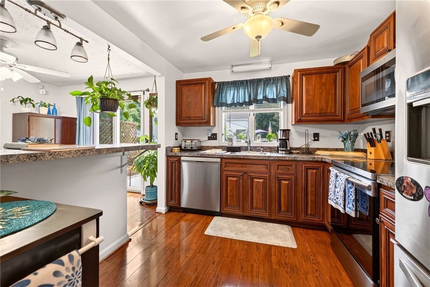 Welcome to this beautifully maintained raised ranch nestled on - photo 21