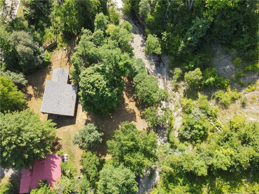 Beautiful contemporary home tucked into the woods with a creek - photo 2