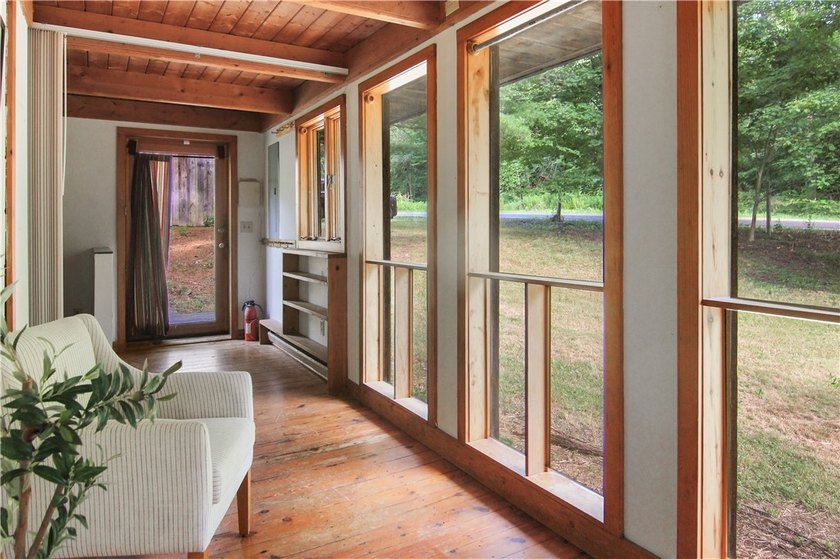 Beautiful contemporary home tucked into the woods with a creek - photo 4