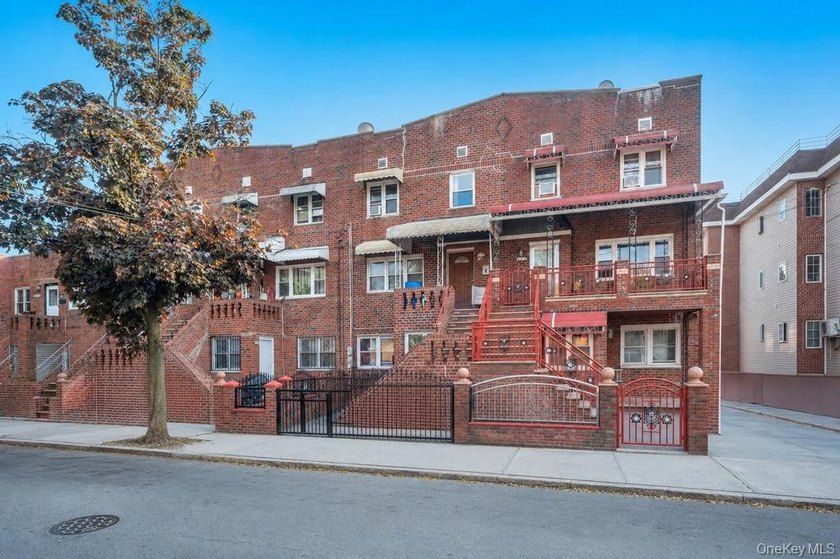 Welcome to 1128 E 84th Street, a well-maintained two-family home - photo 2