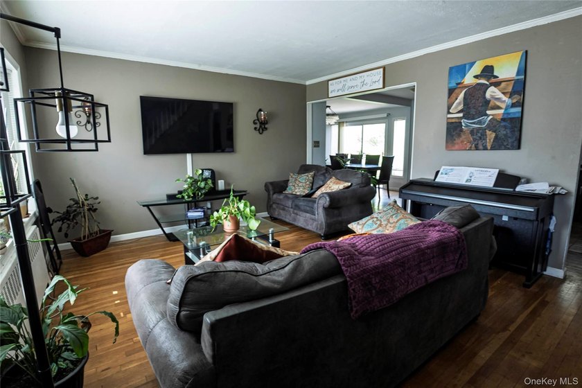Welcome to this charming 4-bedroom, 2-full-bath Cape located in - photo 9