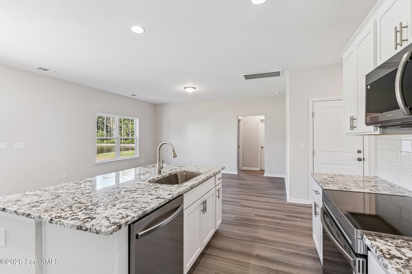 The Magnolia plan by Smith Family Homes is under construction in - photo 8
