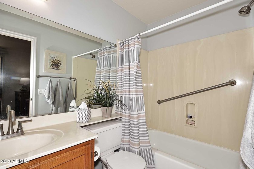 Ideal interior location with south facing patios on the big - photo 11