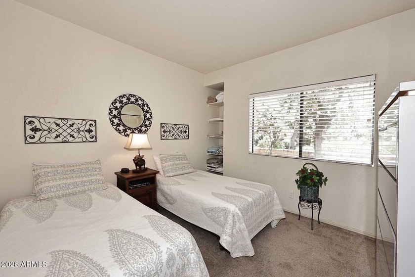 Ideal interior location with south facing patios on the big - photo 13