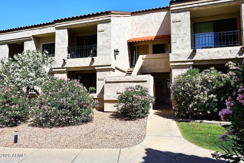Ideal interior location with south facing patios on the big - photo 17