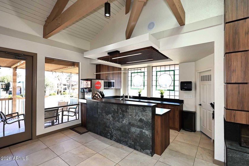Ideal interior location with south facing patios on the big - photo 21