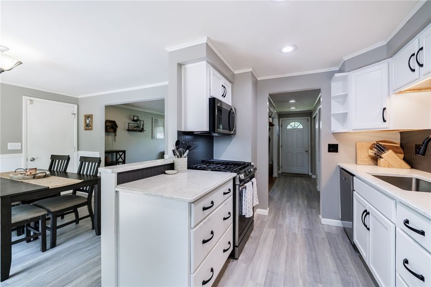 Welcome home to this beautifully updated split-level in the - photo 3