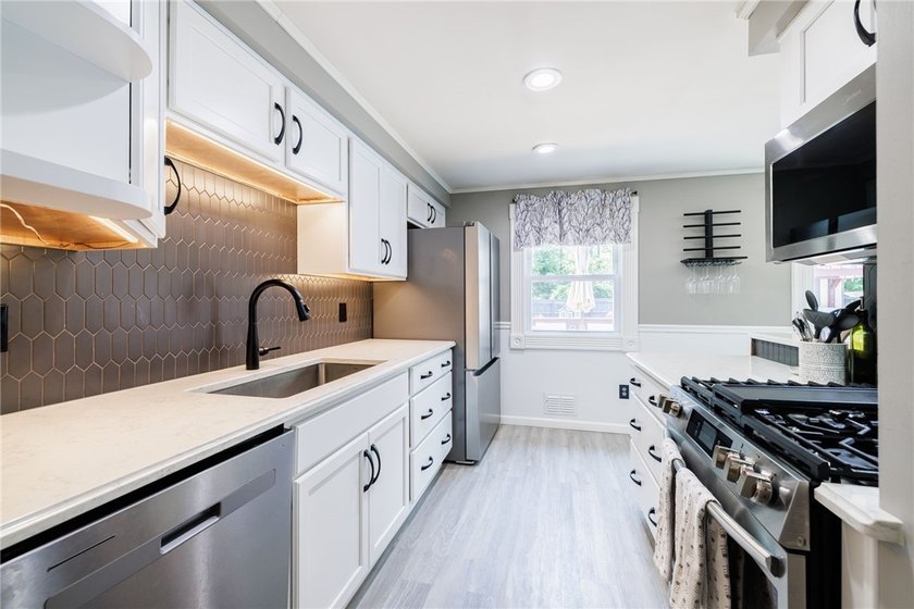 Welcome home to this beautifully updated split-level in the - photo 5