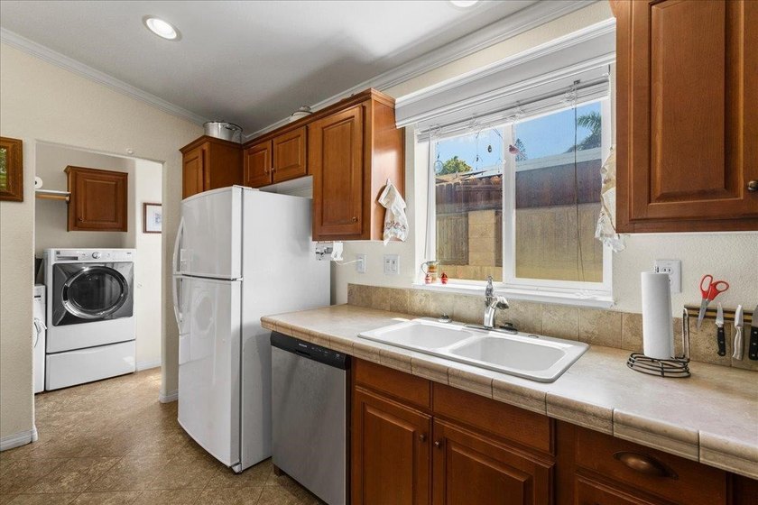 Welcome home to this charming 3-bedroom, 2-bath residence tucked - photo 11