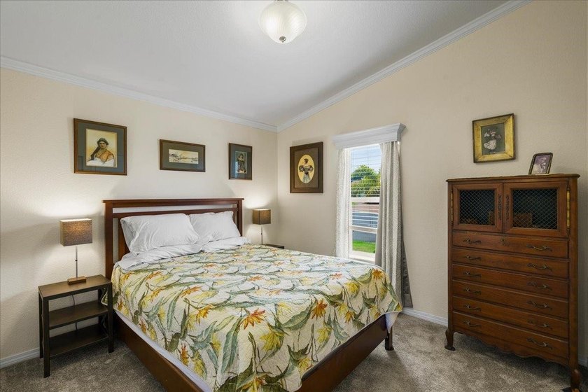 Welcome home to this charming 3-bedroom, 2-bath residence tucked - photo 25