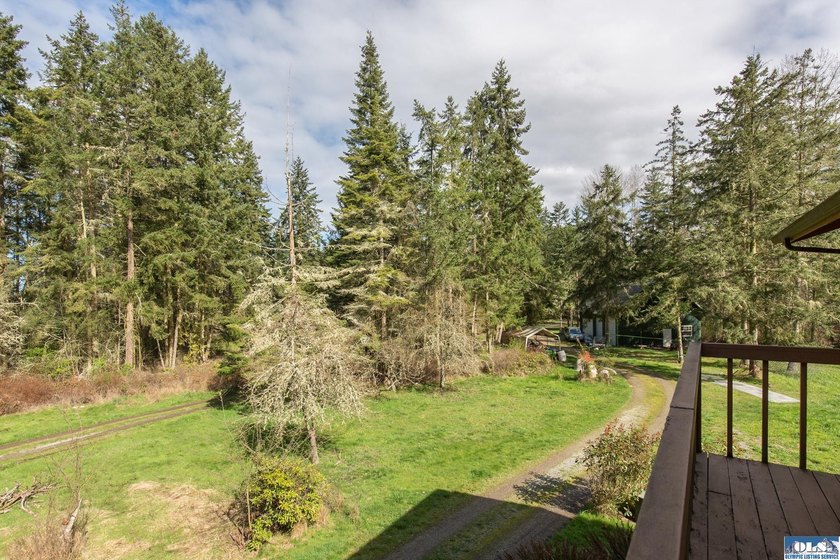 Nestled on 5 private acres in Sequim, this stunning 3 - photo 4