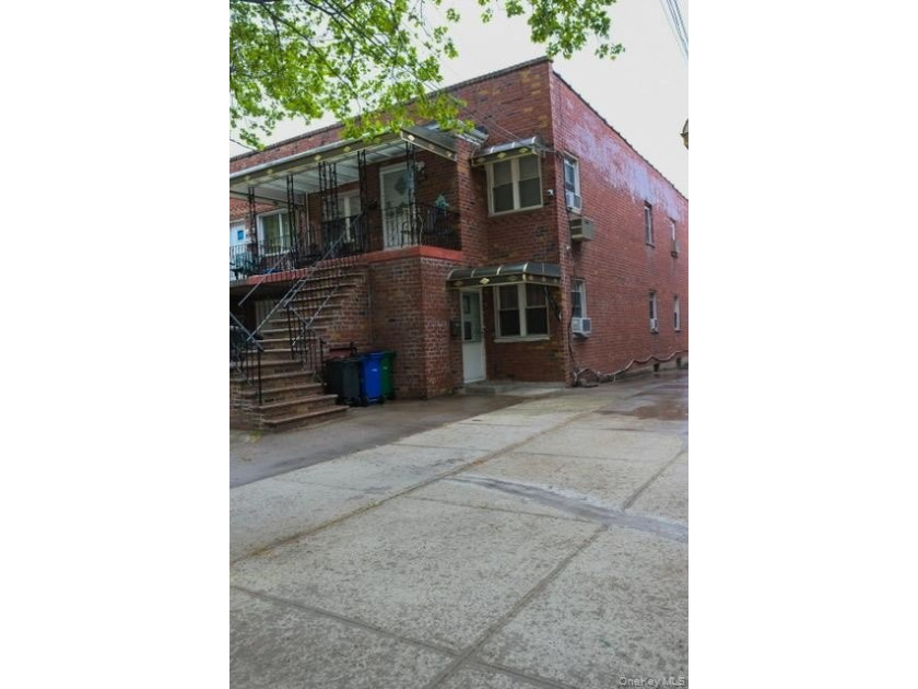 Welcome to this well-maintained two-family brick home located in - photo 2