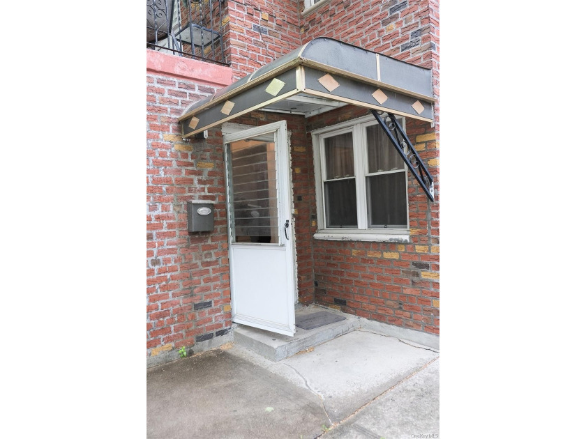 Welcome to this well-maintained two-family brick home located in - photo 3