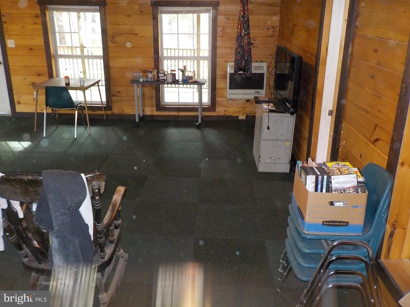 Recreational use wood frame cabin with detached garage and pond - photo 3