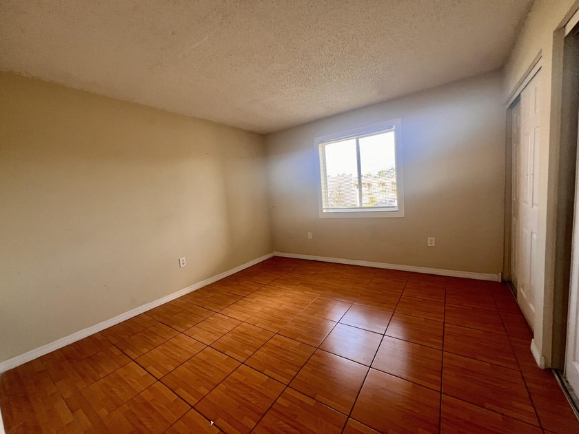 FOR SALE-Second floor condo 2 bedroom 1 bath. AC and Water - photo 9