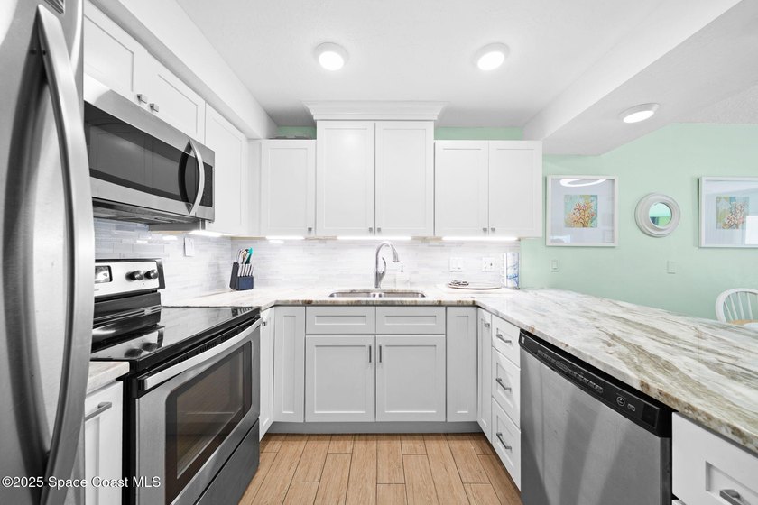 Live the coastal dream in this beautifully updated ground floor - photo 12