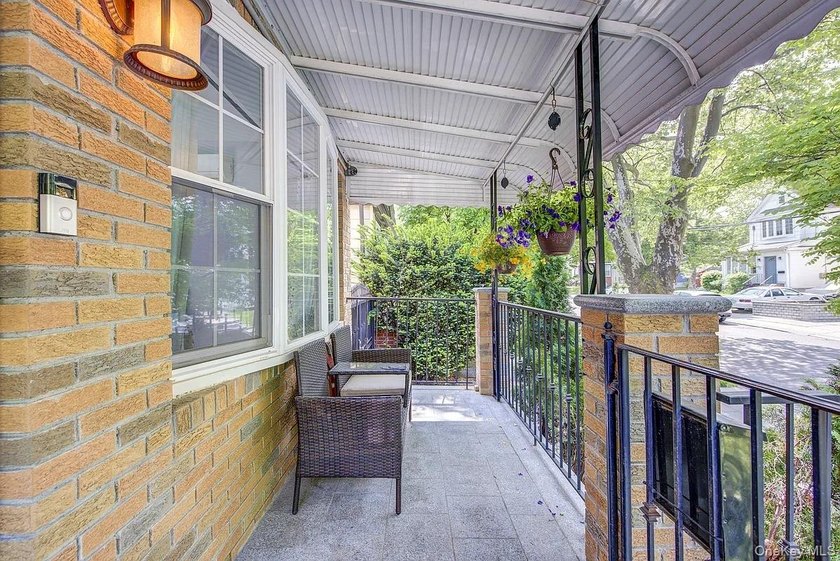 Welcome to 90-10 69th Avenue - a private, detached 2-family home - photo 2