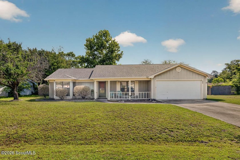 Welcome home to this charming 3-bedroom, 2-bath residence in the - photo 2
