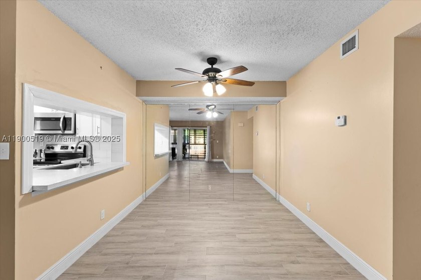 Welcome to this beautifully upgraded corner unit condo in the - photo 5