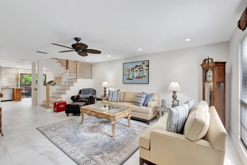 Envision residing just steps away from the serene beachfront of - photo 2