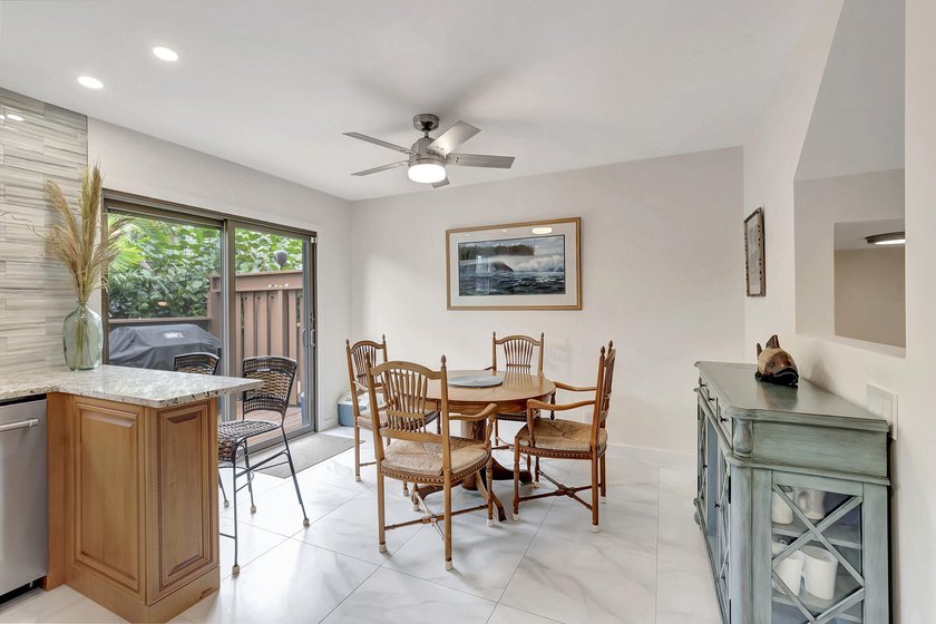 Envision residing just steps away from the serene beachfront of - photo 4