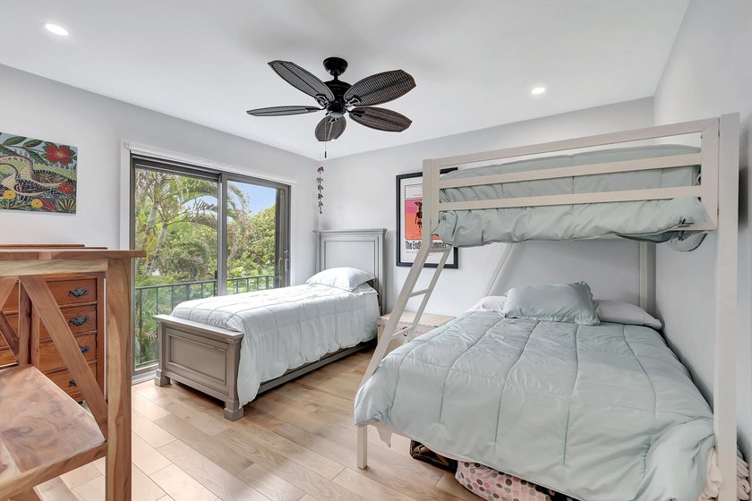 Envision residing just steps away from the serene beachfront of - photo 10