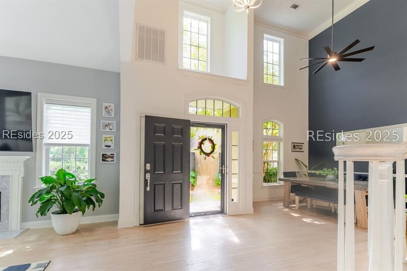 This stunning, end-unit townhome features a grand two-story - photo 3