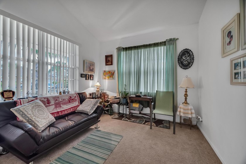 Nestled in the desirable gated community of Magnolia Lakes in - photo 12
