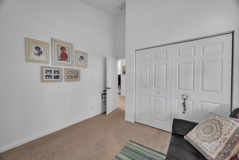 Nestled in the desirable gated community of Magnolia Lakes in - photo 13