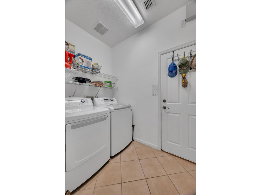 Nestled in the desirable gated community of Magnolia Lakes in - photo 17