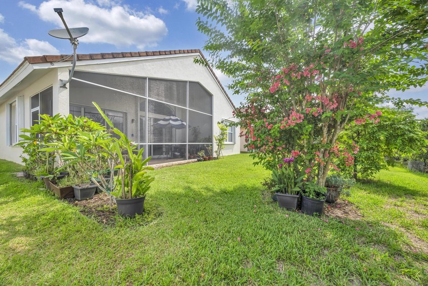 Nestled in the desirable gated community of Magnolia Lakes in - photo 19