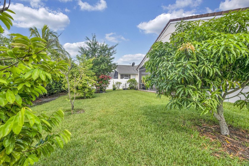 Nestled in the desirable gated community of Magnolia Lakes in - photo 22