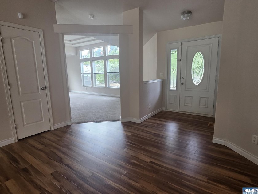 Space and natural light abound in this beautifully maintained - photo 2