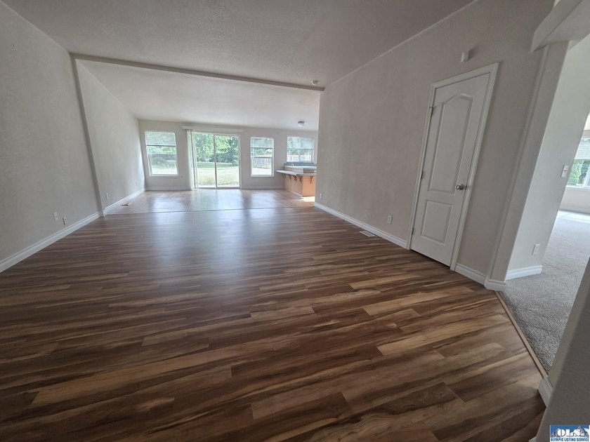 Space and natural light abound in this beautifully maintained - photo 3