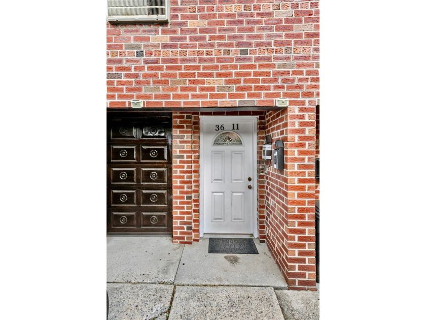 36-11 Utopia Parkway is a detached brick legal 2-family home - photo 5