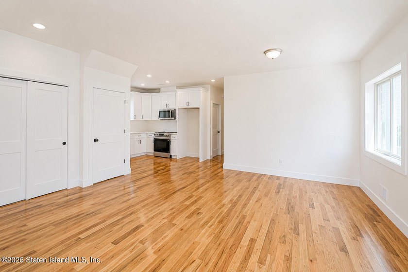 An exceptional new construction 6/6 two-family home offering 2 - photo 8