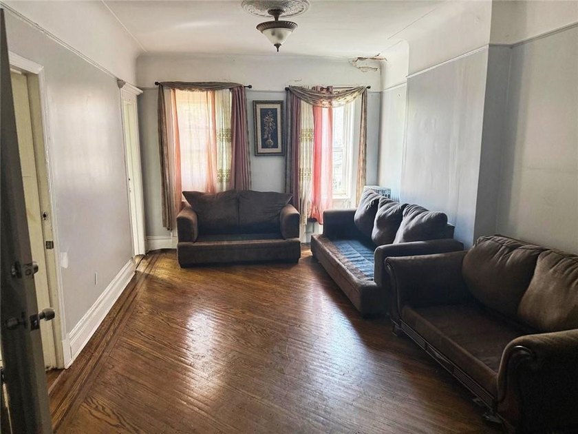 This five-bedroom, two-bathroom multi-unit property is located - photo 4