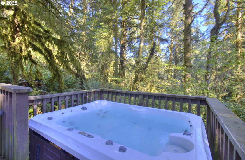 Tucked into a serene wooded setting alongside a peaceful creek - photo 5