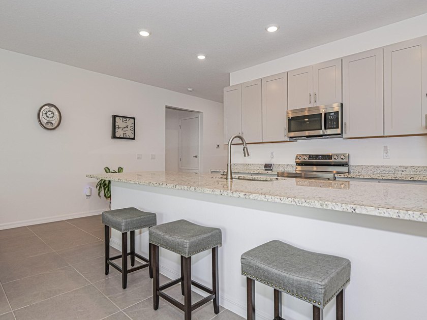 LIKE NEW beautiful 2022 built concrete block home located in the - photo 9