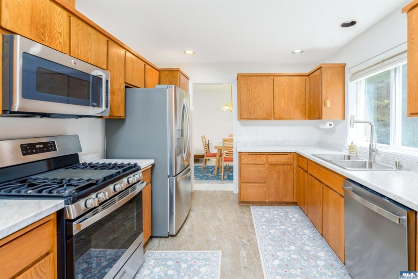 Welcome to this spacious 4-bedroom, 2.5-bath home on 5 peaceful - photo 10