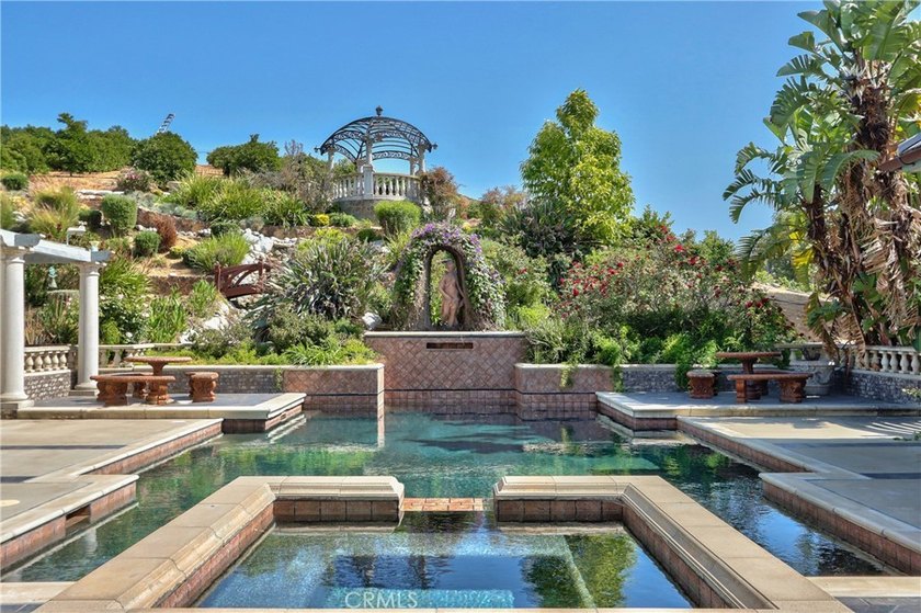 Positioned atop 20.22 fully fenced and gated acres, this stately - photo 12
